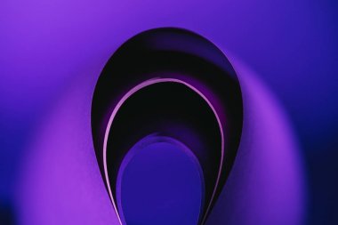 arcs of warping purple paper on purple 