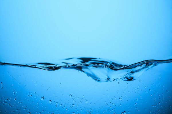 clear water texture with drops, isolated on blue
