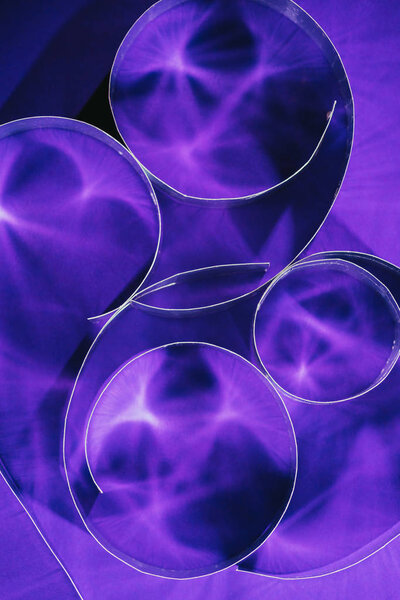 top view of paper spirals on purple
