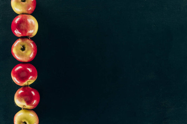 top view of arranged fresh apples isolated on black
