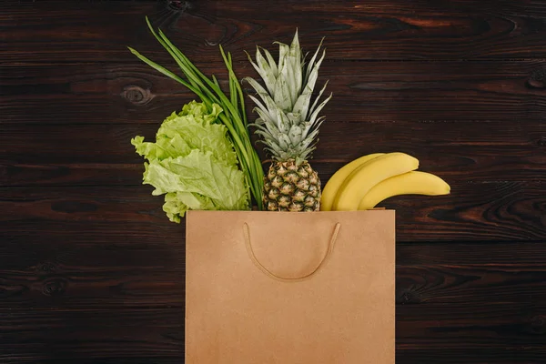 Top View Chinese Cabbage Pineapple Bananas Shopping Bag Wood Table — Stok Foto