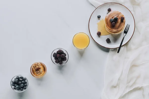 Top View Tasty Breakfast Pancakes Berries Honey Juice Grey — Stock Photo, Image
