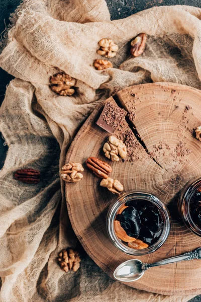 Top View Sweet Gourmet Chocolate Dessert Nuts Wooden Board — Free Stock Photo