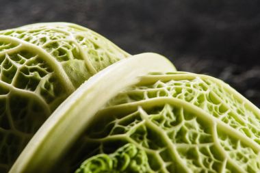 close-up view of fresh healthy savoy cabbage on black clipart