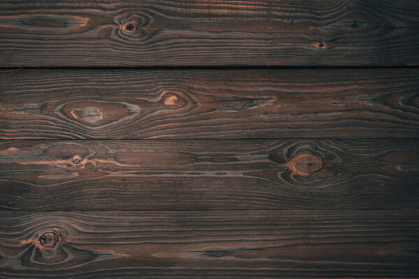 top view of dark wooden planks, wooden background 