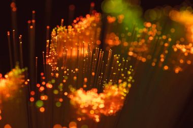 selective focus of shiny orange fiber optics background clipart