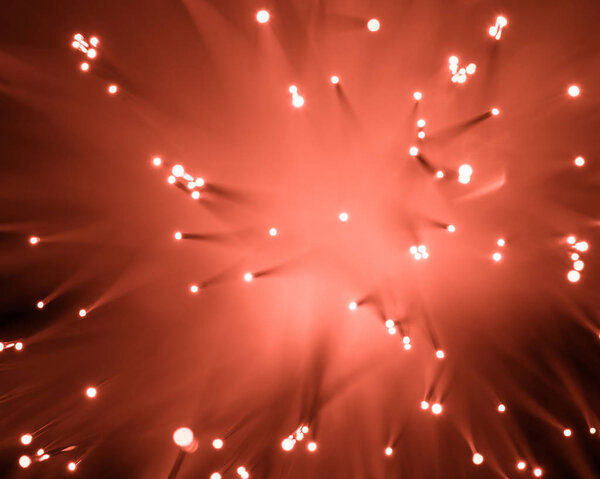 top view of blurred glowing red fiber optics texture 