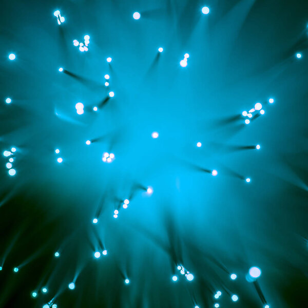 top view of blurred glowing blue fiber optics background