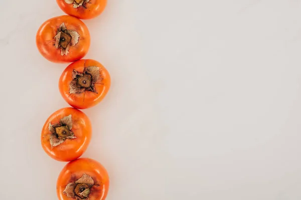 Top View Persimmons Row Isolated White — Stock Photo, Image