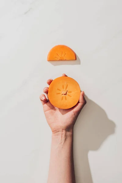 Cropped Image Woman Holding Persimmon Piece White — Stock Photo, Image