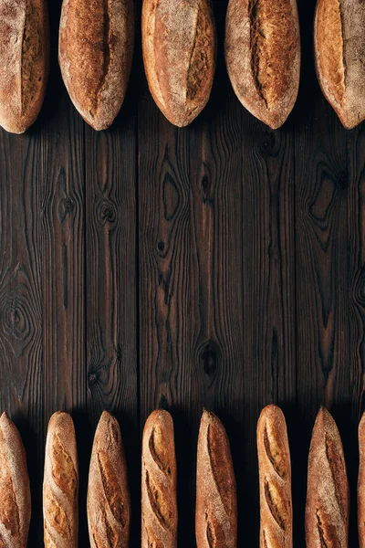 Top View Arranged Loafs Bread French Baguettes Wooden Surface — Stock Photo, Image