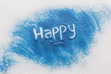 top view of happy sign made of blue sand on white surface clipart