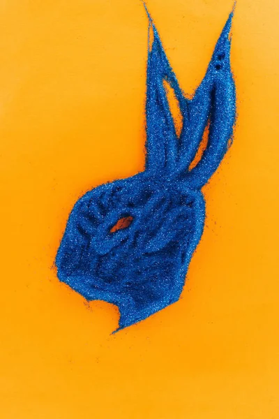Top View Blue Easter Bunny Made Sand Isolated Orange — Free Stock Photo