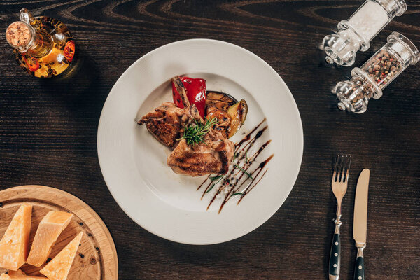 top view of grilled chicken with vegetables on plate