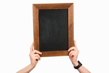 Cropped view of woman hands holding empty blackboard isolated on white clipart