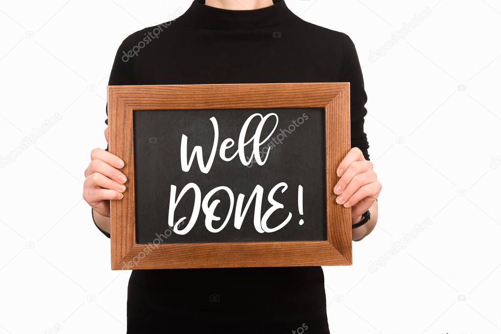 Partial view of woman holding board with lettering well done isolated on white