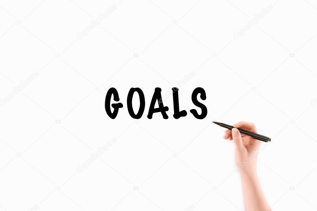 cropped image of woman writing goals inscription isolated on white