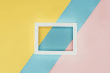top view of white empty wooden frame on colorful background clipart