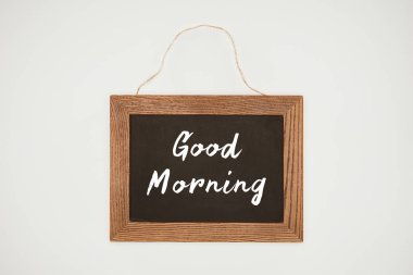 good morning lettering on chalkboard with wooden frame and thread isolated on white clipart