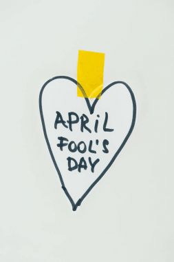 close up view of hand drawn heart and april fools day lettering isolated on grey, april fools day concept clipart