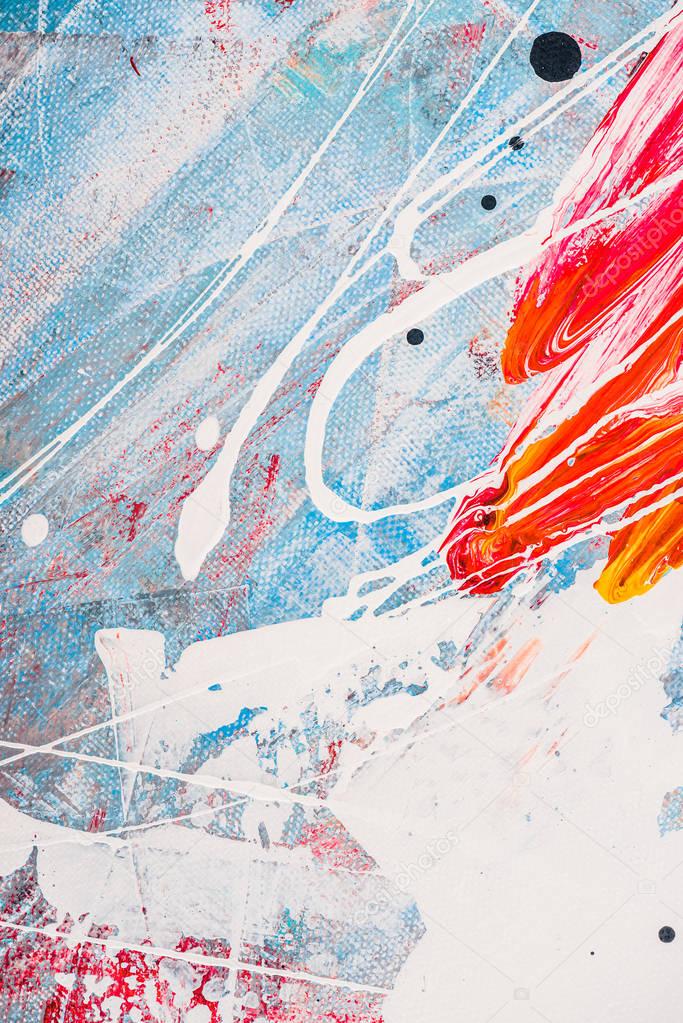 splatters of oil paint on abstract colorful background 