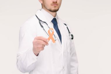 cropped shot of doctor with stethoscope showing orange leukemia, kidney cancer, multiple sclerosis RSD awareness ribbon isolated on white clipart