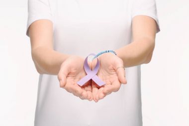 cropped shot of woman holding purple awareness ribbon for general cancer awareness, Lupus awareness, drug overdose, domestic violence symbol in hands isolated on white clipart