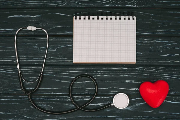 Flat Lay Arranged Red Heart Stethoscope Empty Notebook Dark Wooden — Stock Photo, Image