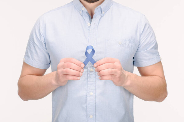 partial view of man with blue awareness ribbon isolated on white, colon cancer concept