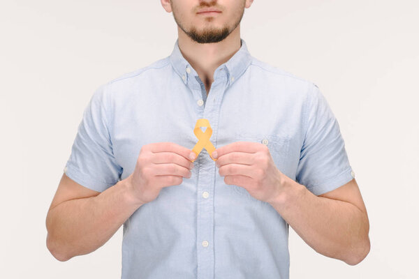 partial view of man with yellow  ribbon isolated on white, world health day concept