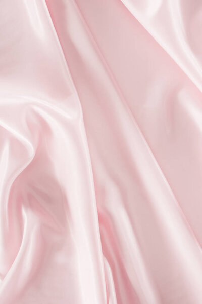 светло-розовый блестящий атласная ткань фона
