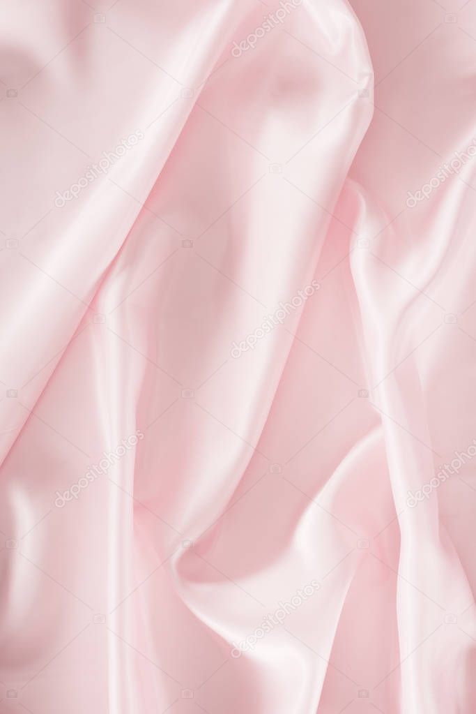light pink shiny satin fabric background