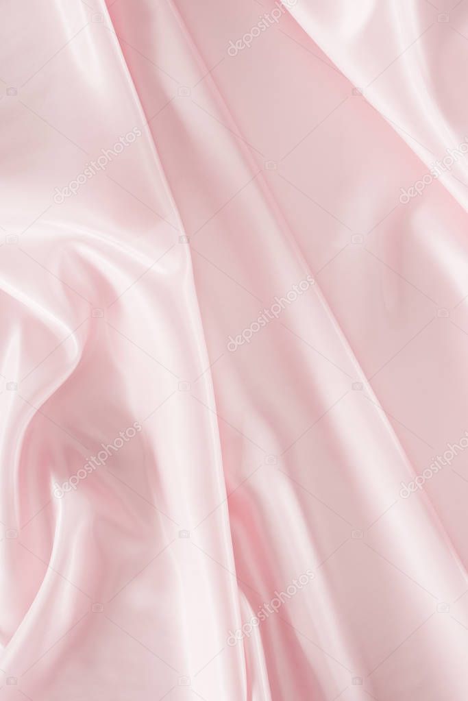 light pink shiny satin fabric background