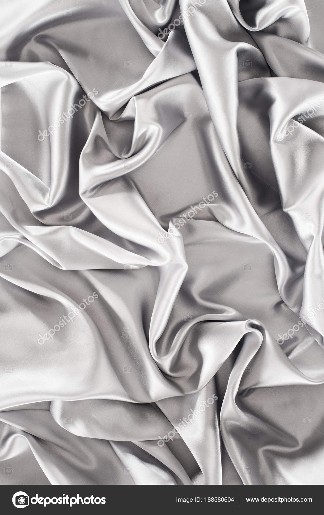 皱巴巴的银色丝绸织品背景——图库图片© VadimVasenin #188580604, image size:1068x1700