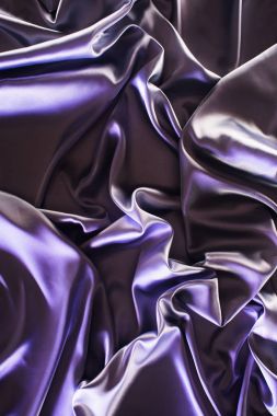 ultra violet crumpled shiny silk fabric background