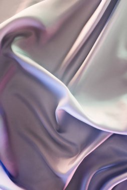 light violet and beige shiny silk fabric background