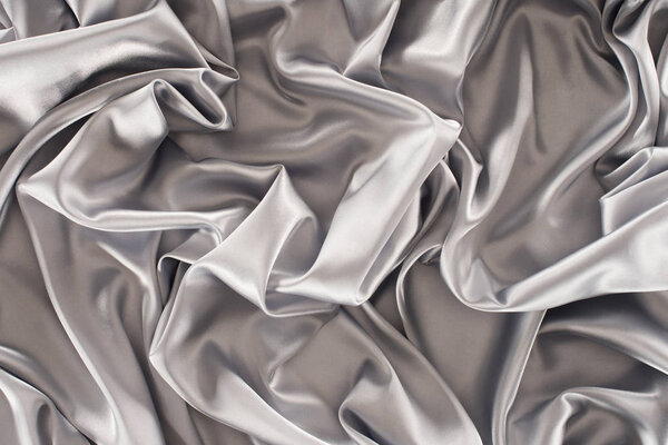 crumpled silver satin fabric background
