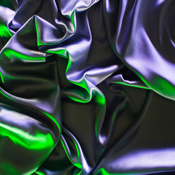 green and violet crumpled shiny silk fabric background