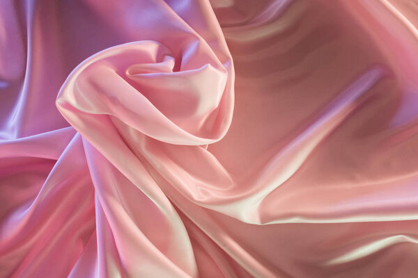 beige and pink shiny silk fabric background