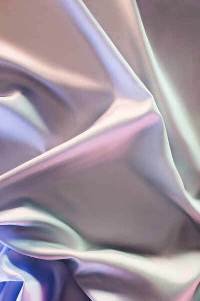 beige and violet shiny silk fabric background