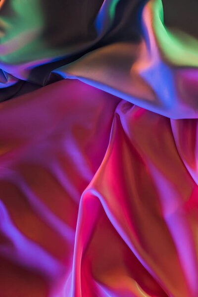 розовый и зеленый блестящий шелковый фон
