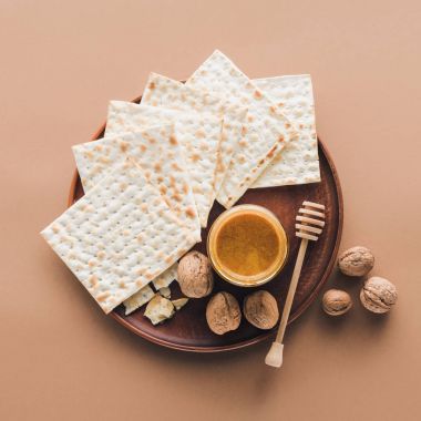 top view of matza with honey on tray, Passover Haggadah concept clipart
