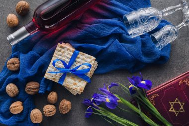 top view of matza, torah and wine on table, jewish Passover holiday concept clipart