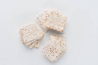 top view of matza on white table, Pesah celebration concept clipart