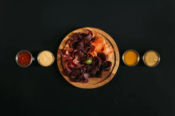 Top View Delicious Sliced Assorted Meat Wooden Board Various Sauces — Stock Photo, Image