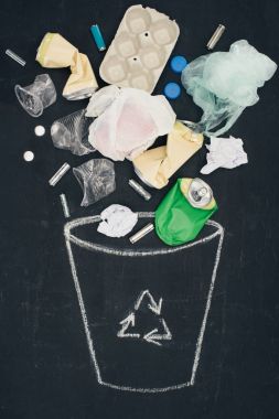 various types of trash falling into drawn trash bin with recycle sign on chalkboard clipart