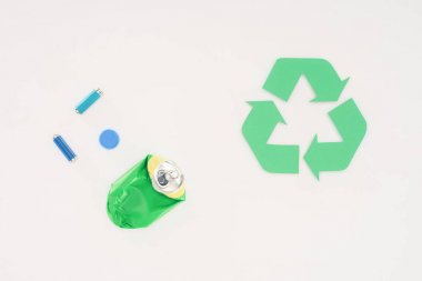 top view of various trash with recycle sign on white clipart