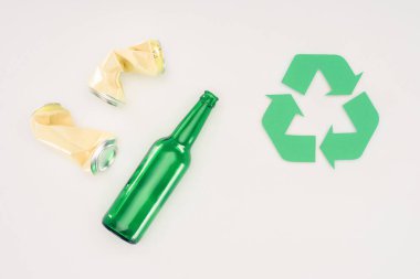 top view of beer cans and bottle with recycle sign on white clipart