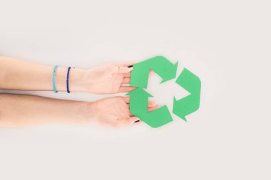 cropped shot of woman holding recycle sign on white clipart