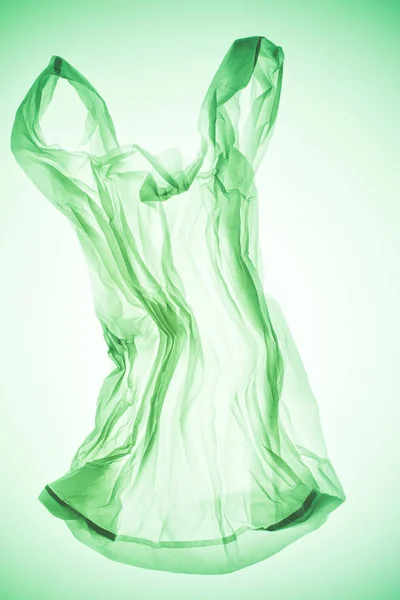 Saco Plástico Transparente Amassado Sob Luz Verde Colorida — Fotografia de Stock